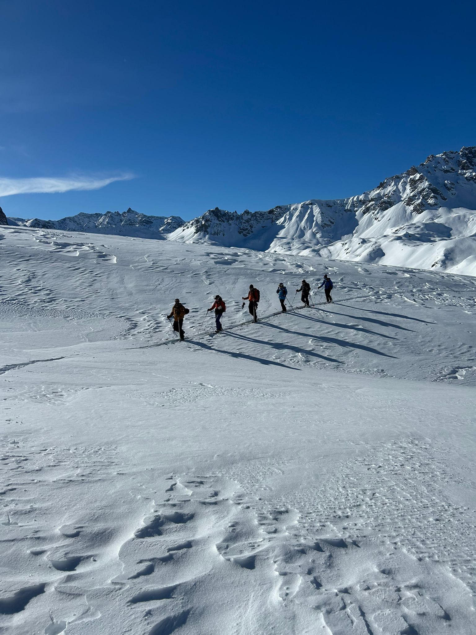 Group of ski tourers climbing up the mountain